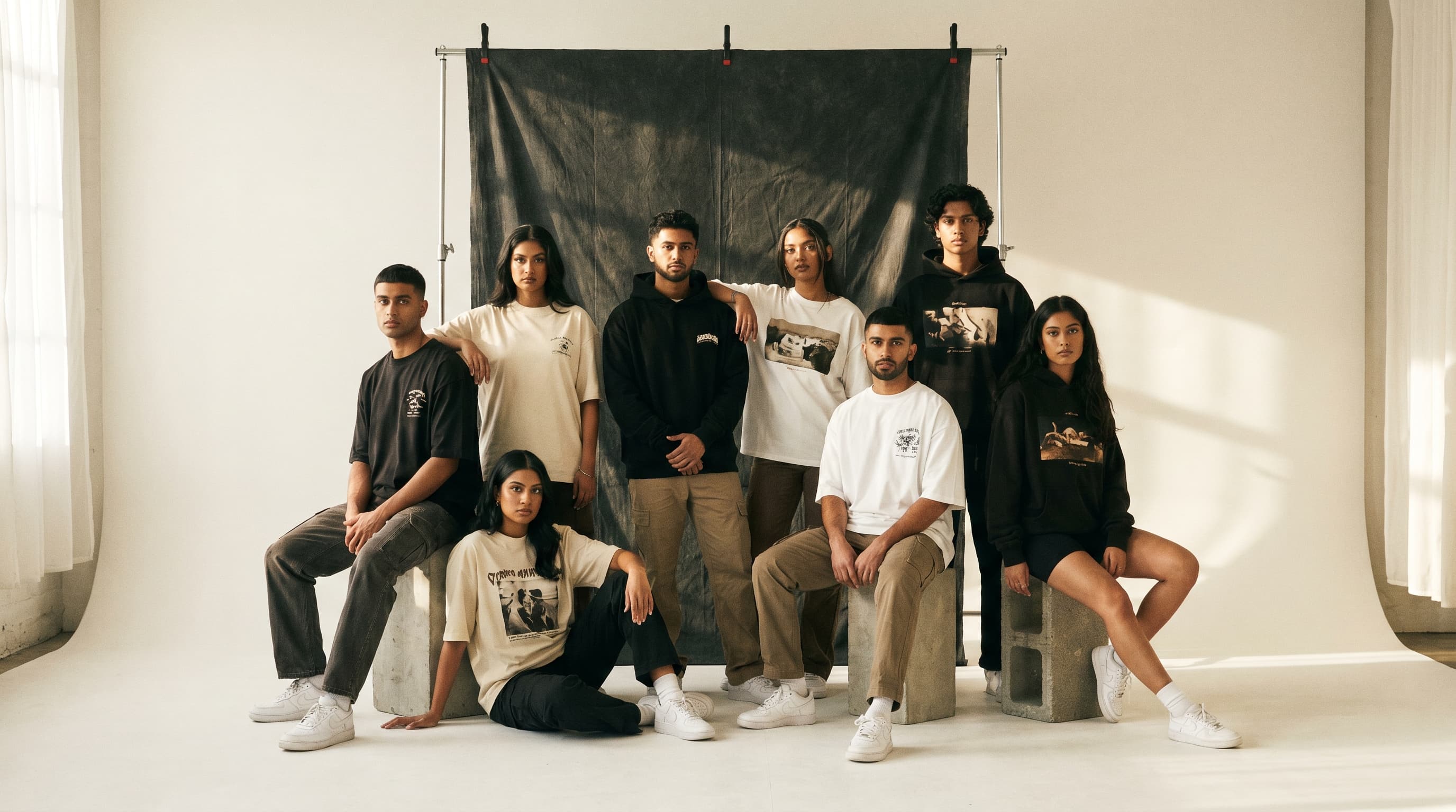 The RAAH studio campaign: eight people in oversized RAAH tees and hoodies